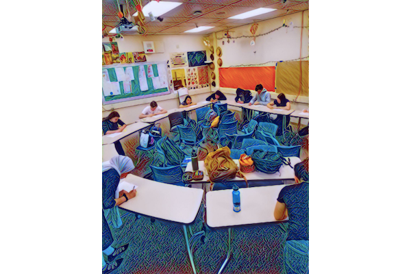 Students circle their desks to peer review each other's work.